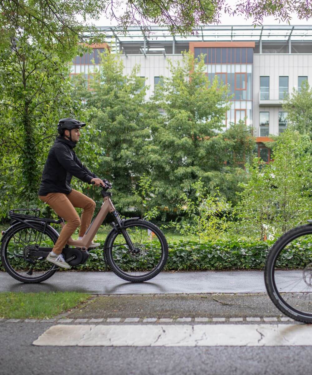 Moustache Xroad FS 6 electric bike riding on trail in Gatineau Park