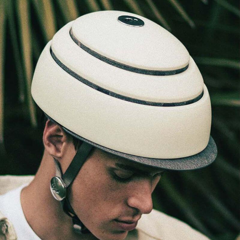 Commuter wearing an eBike helmet while cycling through urban traffic on a city street