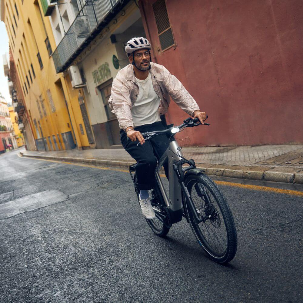 Man riding an electric bike in Canada as a cost-saving alternative to driving