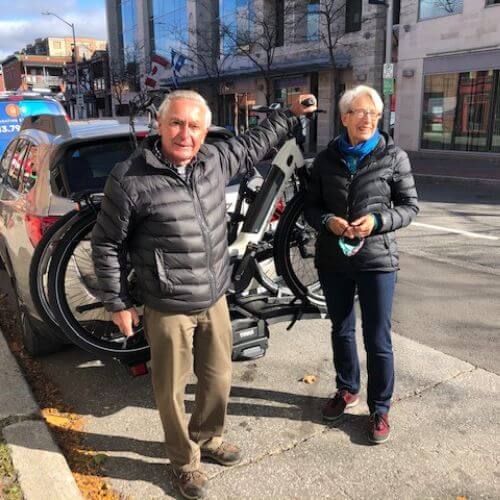 Couple test riding electric bikes at Ottawa electric bike store Scooteretti