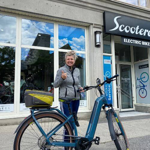 Ottawa commuter with electric bike bought at Scooteretti
