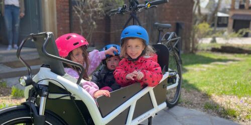 Parents preparing for family riding with electric bike from Scooteretti Ottawa