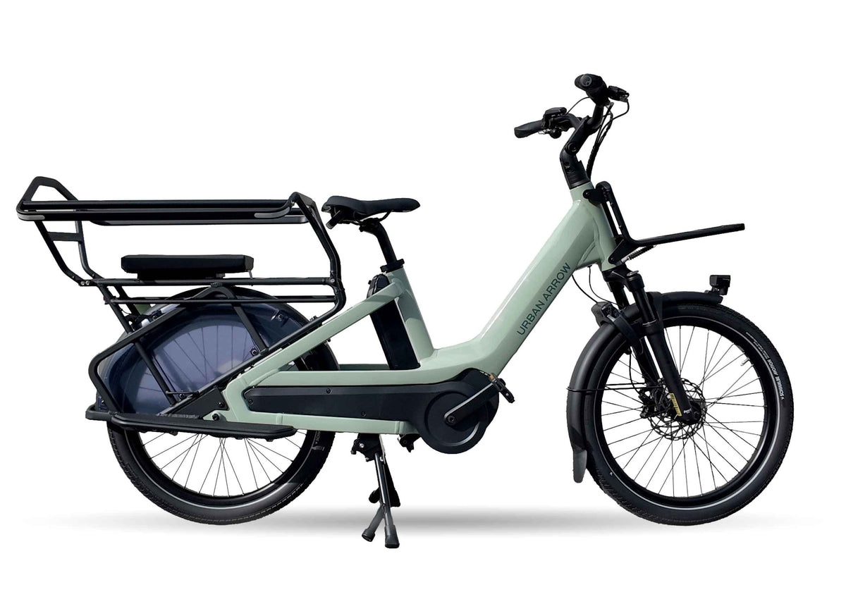 Urban Arrow Breeze compact electric cargo bike in green, shown in full side profile with front and rear cargo racks fitted