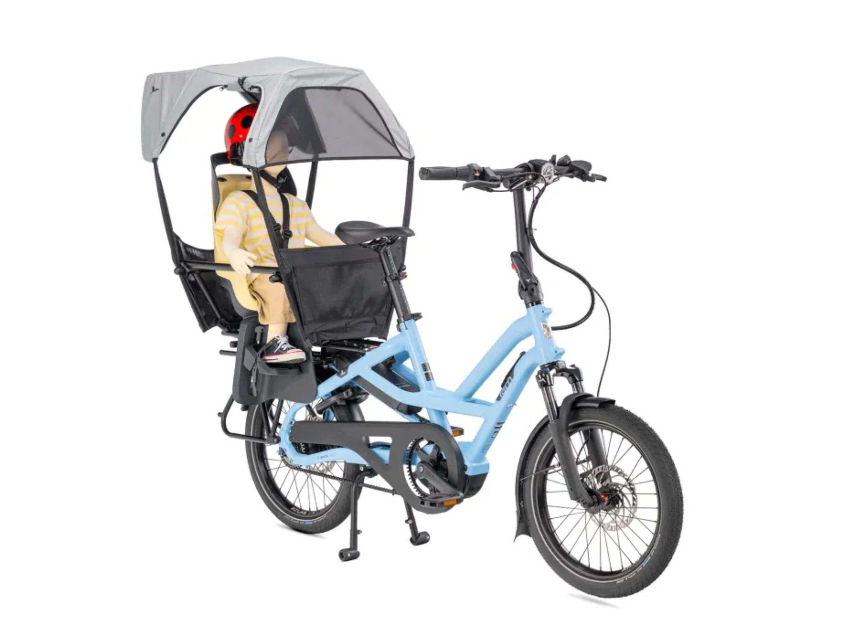 Tern Sun Shield Mini UPF 50 sun canopy installed over a Clubhouse Mini child seat on the rear rack of a Tern electric cargo bike