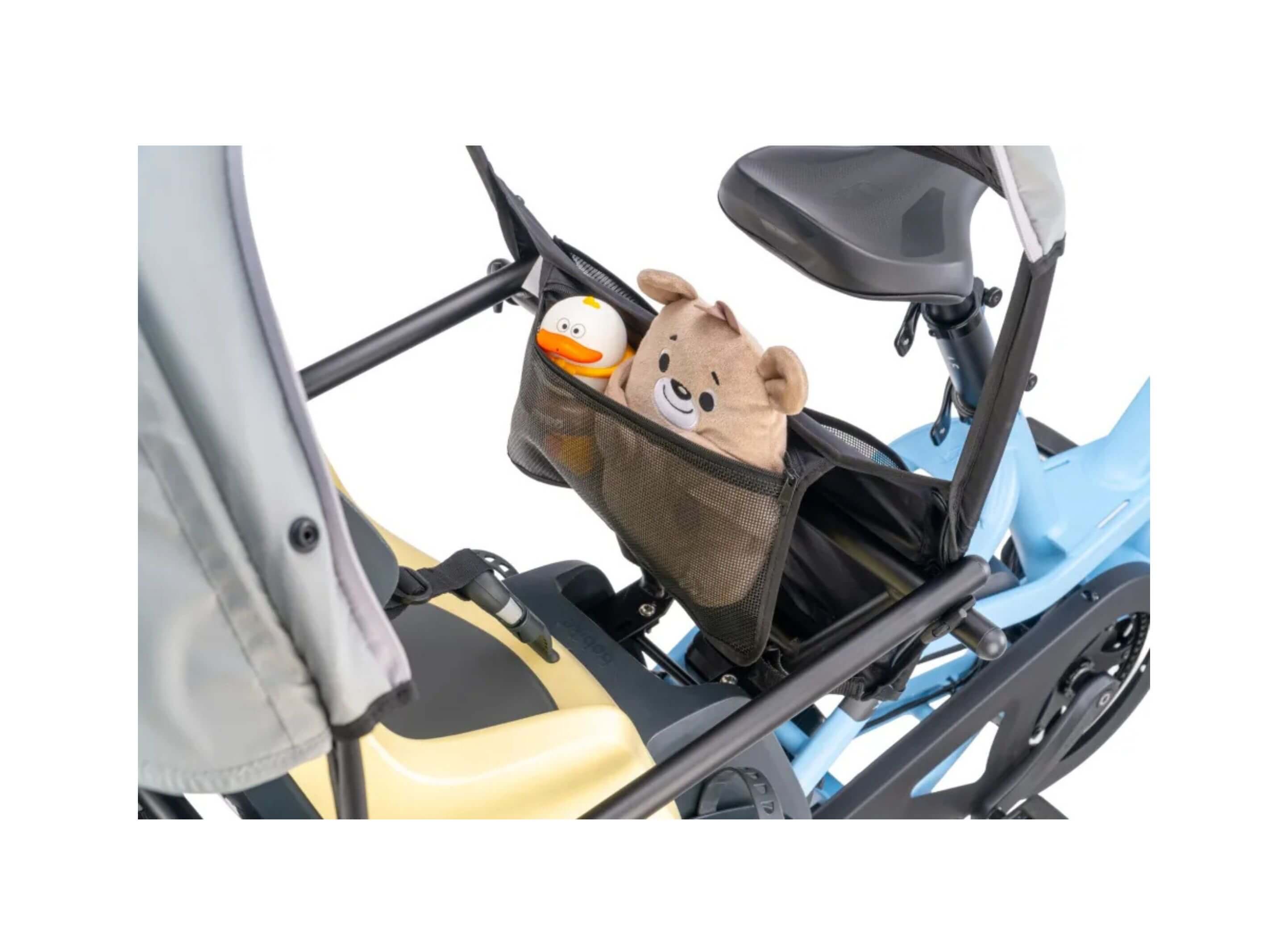 Close-up of the Tern Sun Shield Mini's roll-up side panel, aluminum support pole, and interior storage pocket